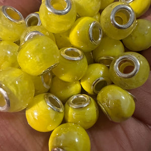 10 yellow big hole beads.