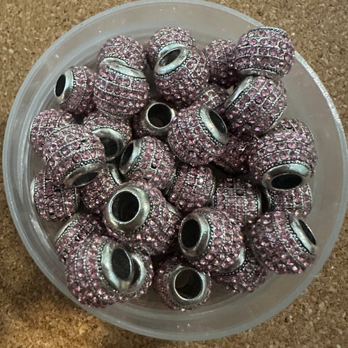5 pink rhinestone beads.