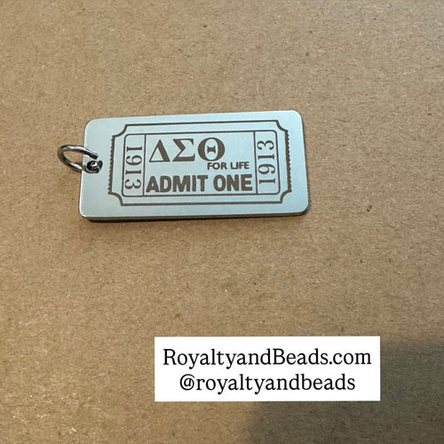 Silver Delta ticket charm.