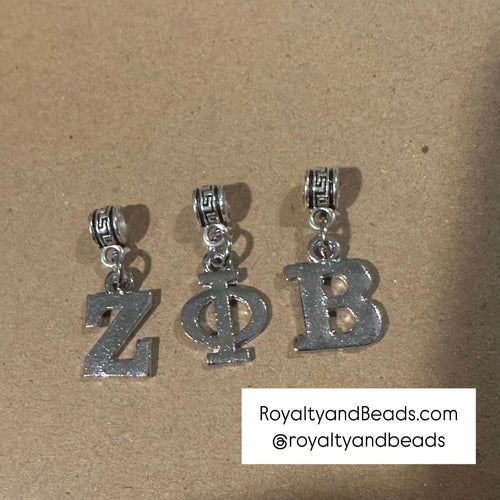 3 silver Zeta Phi Beta letters