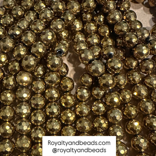Gold faceted hematite beads.