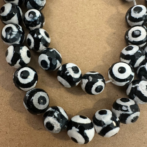 Tan and black circle beads.