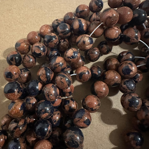 Orange and blue sparkle beads.