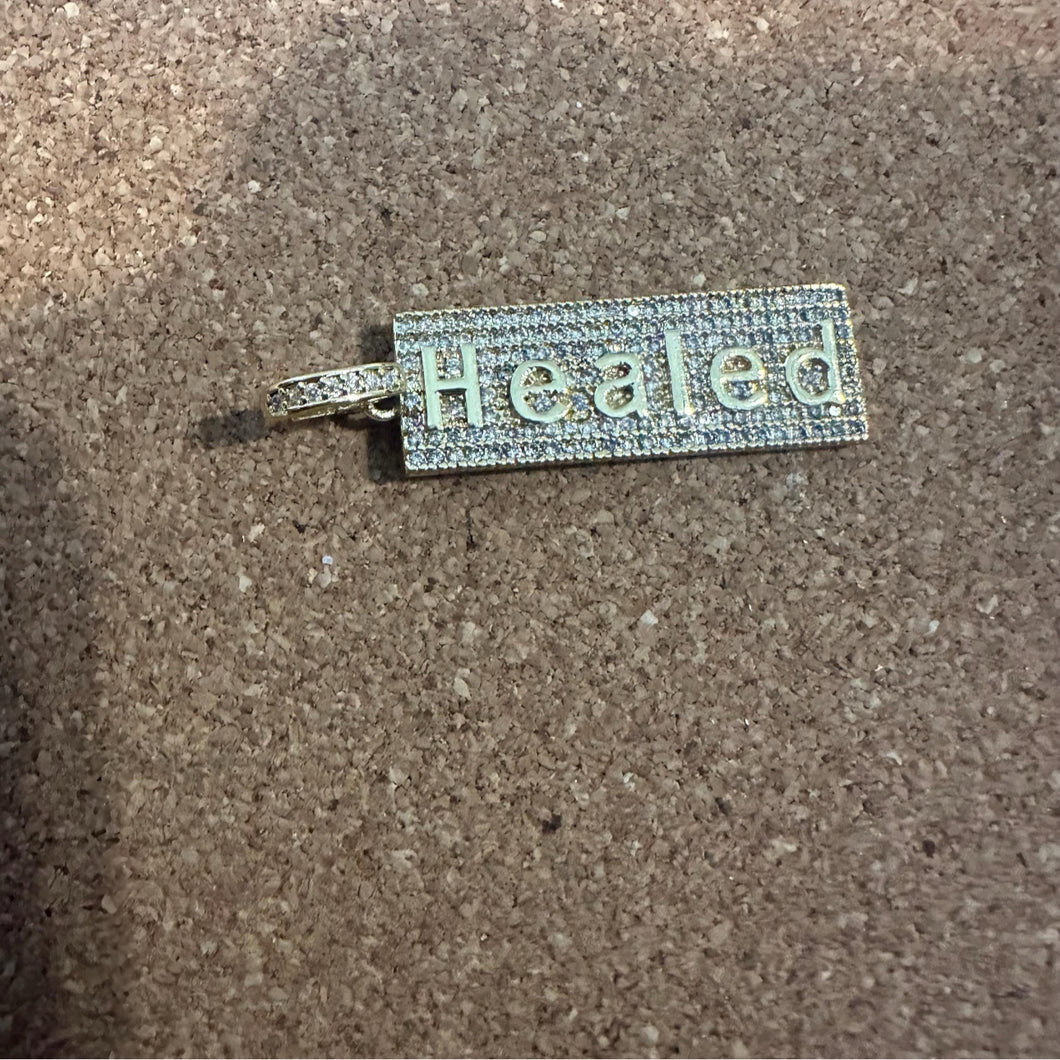 Gold pave healed charm