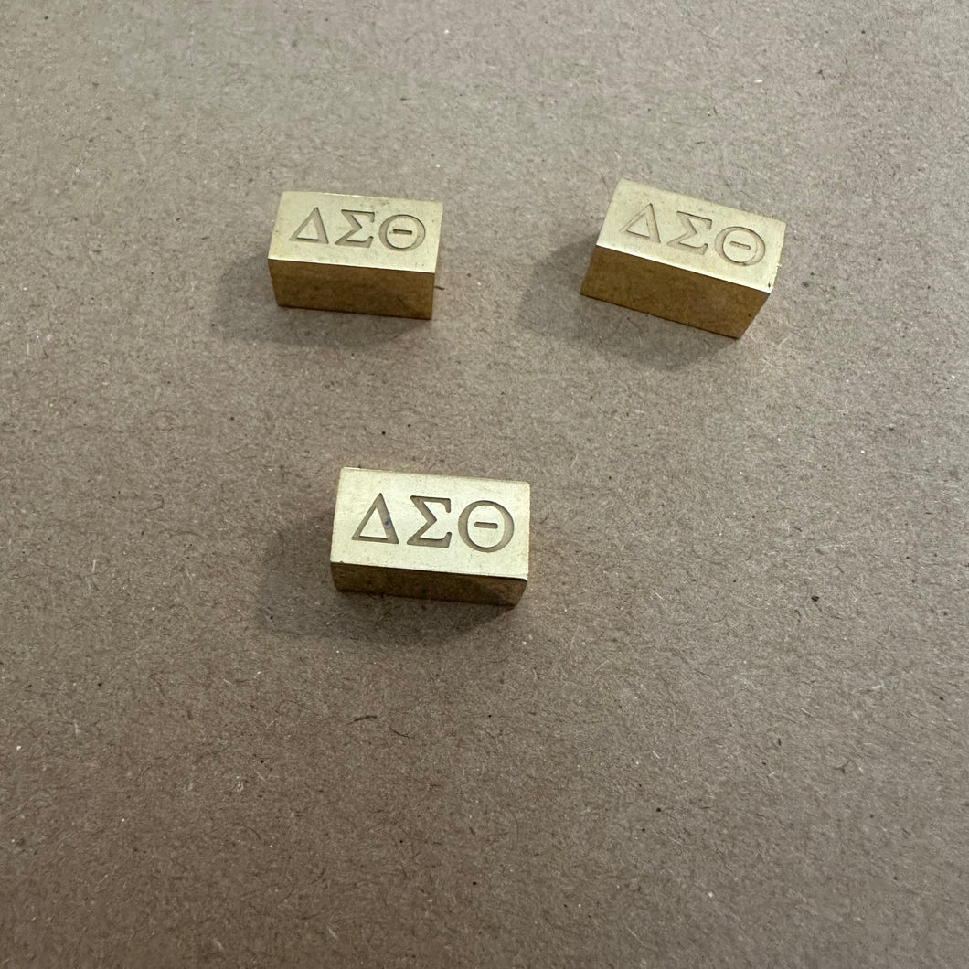 Gold Delta block charm