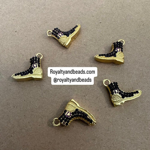 Purple and gold Omega boot charm.