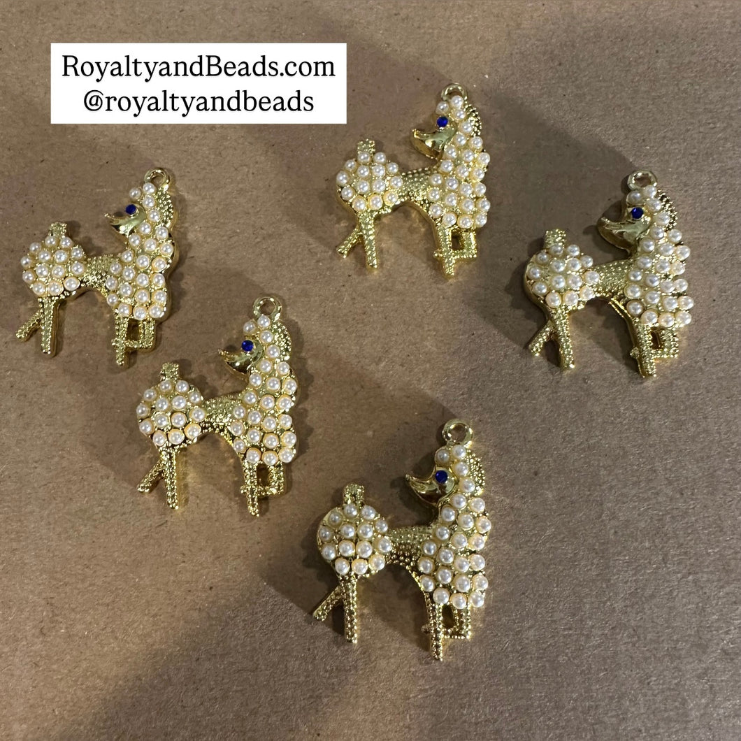 Gold pearl poodle charm.