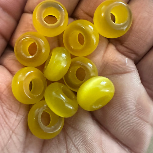 10 yellow big hole beads.