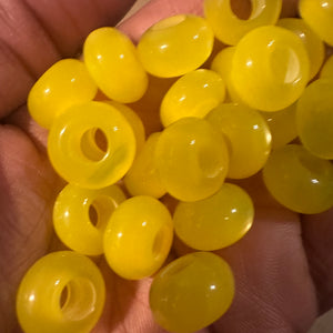 10 yellow big hole beads.