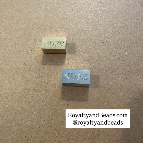 NUPE block charm.