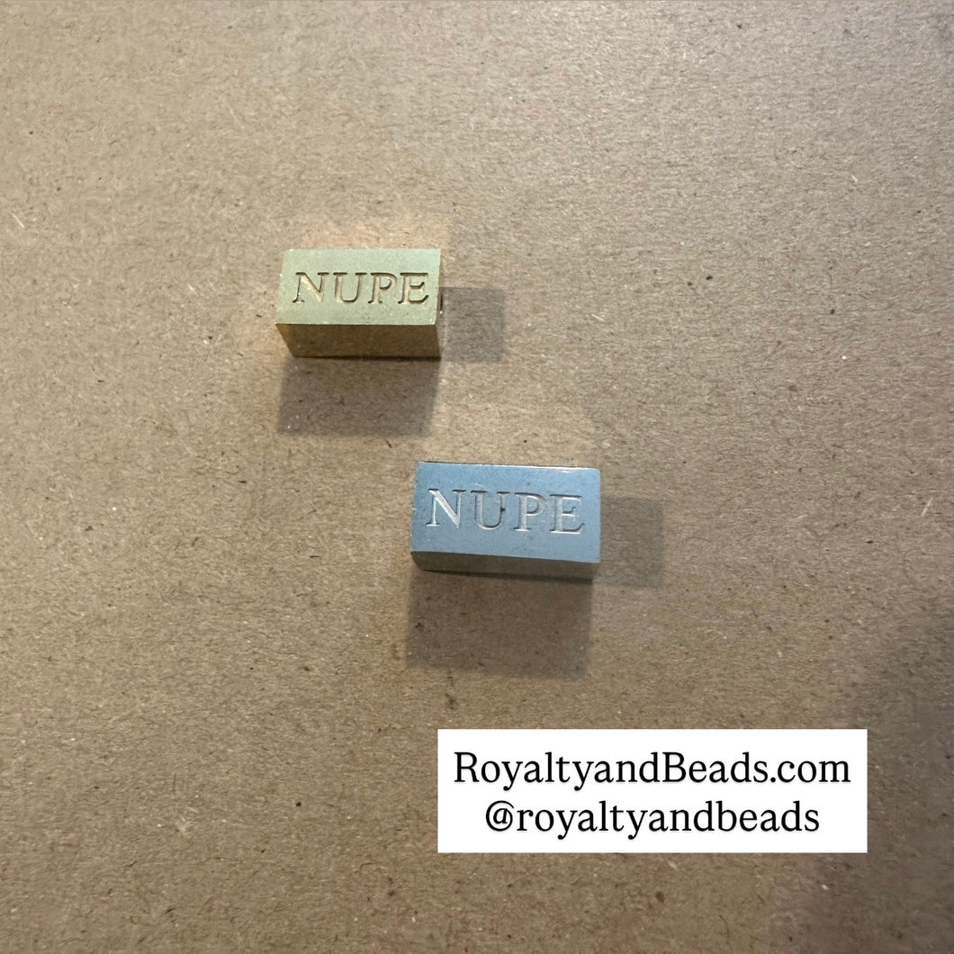 NUPE block charm.