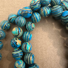 Load image into Gallery viewer, Blue and yellow swirl.