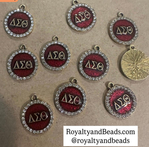 Gold Delta circle charms.