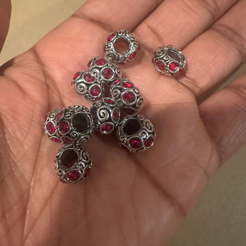 10 red and silver big hole beads.