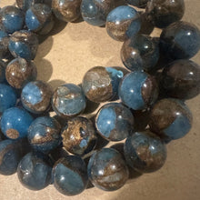 Load image into Gallery viewer, Light blue and gold beads.