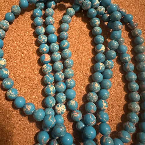 Blue and tan beads 8mm.