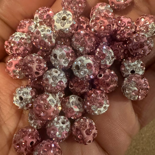 20 pink mixed pave beads.