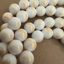 Load image into Gallery viewer, White and gold beads.