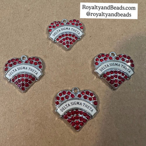 Red Delta heart charm.