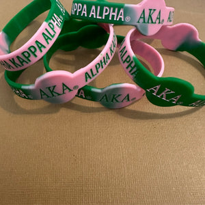 Pink and green Alpha Kappa Alpha wristband