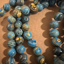 Load image into Gallery viewer, Blue swirl beads.