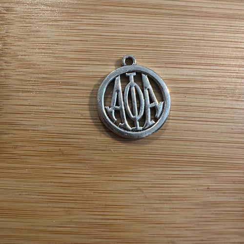 Silver Alpha charm.