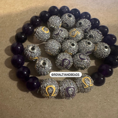 3 Omega pave letters.