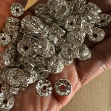 Load image into Gallery viewer, 50 silver rondelle spacers.
