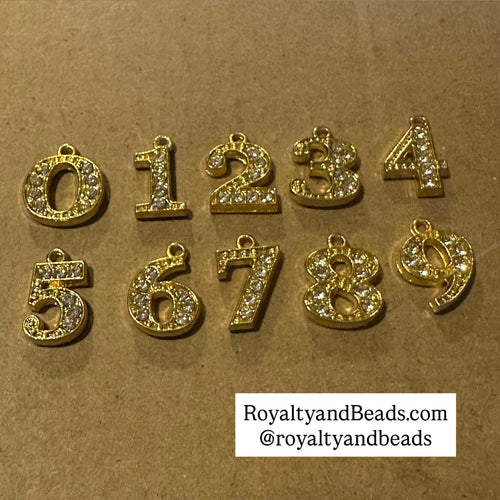 Gold Rhinestone number charm.