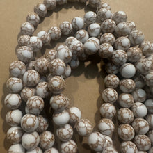 Load image into Gallery viewer, White and gold beads