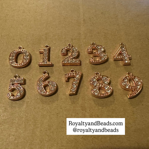 Rose Gold Rhinestone number charm.