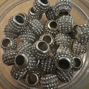 5 silver rhinestone beads.