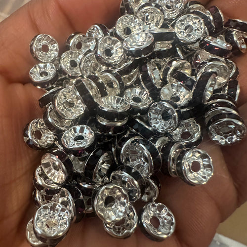 50 purple and silver rondelle spacers.
