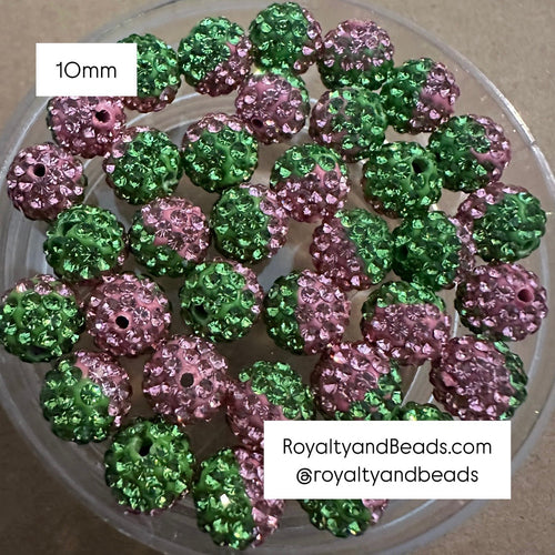 5 pink and green rhinestone beads.