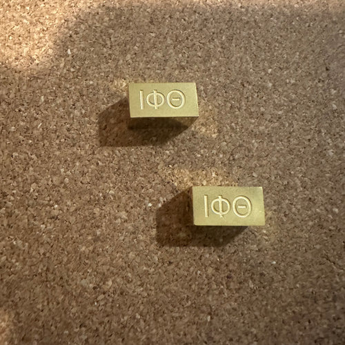 Iota Phi Theta charm.