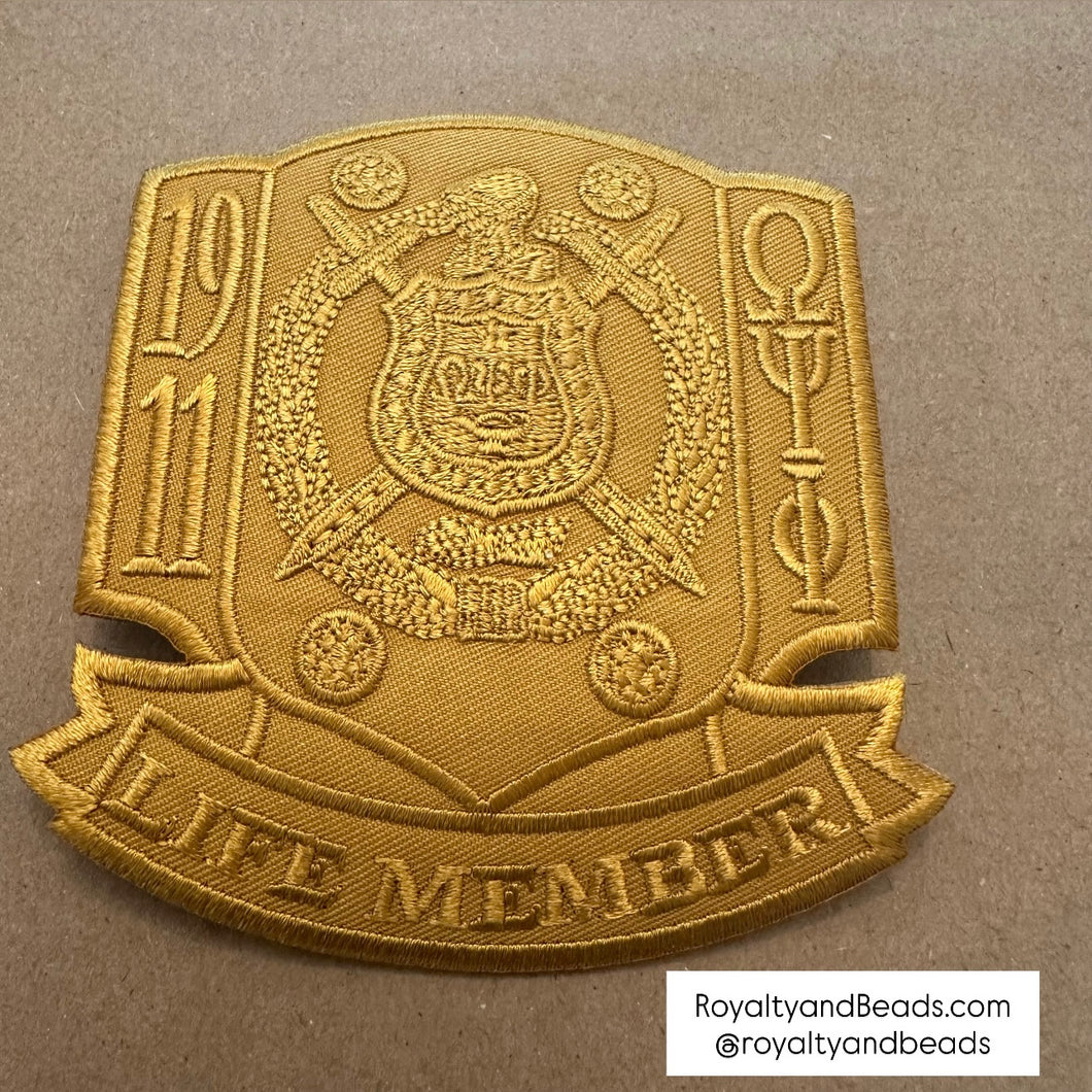 All gold Omega Psi Phi life member patch