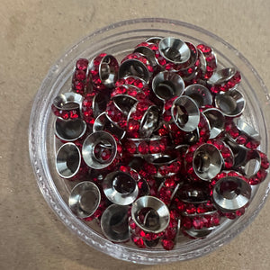 50 red and silver rondelle spacers.