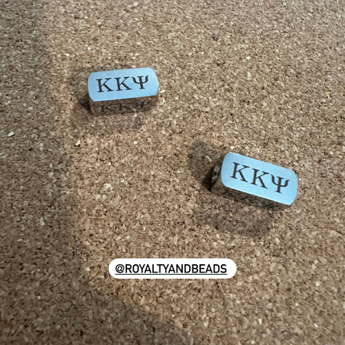 Kappa Kappa Psi charm.