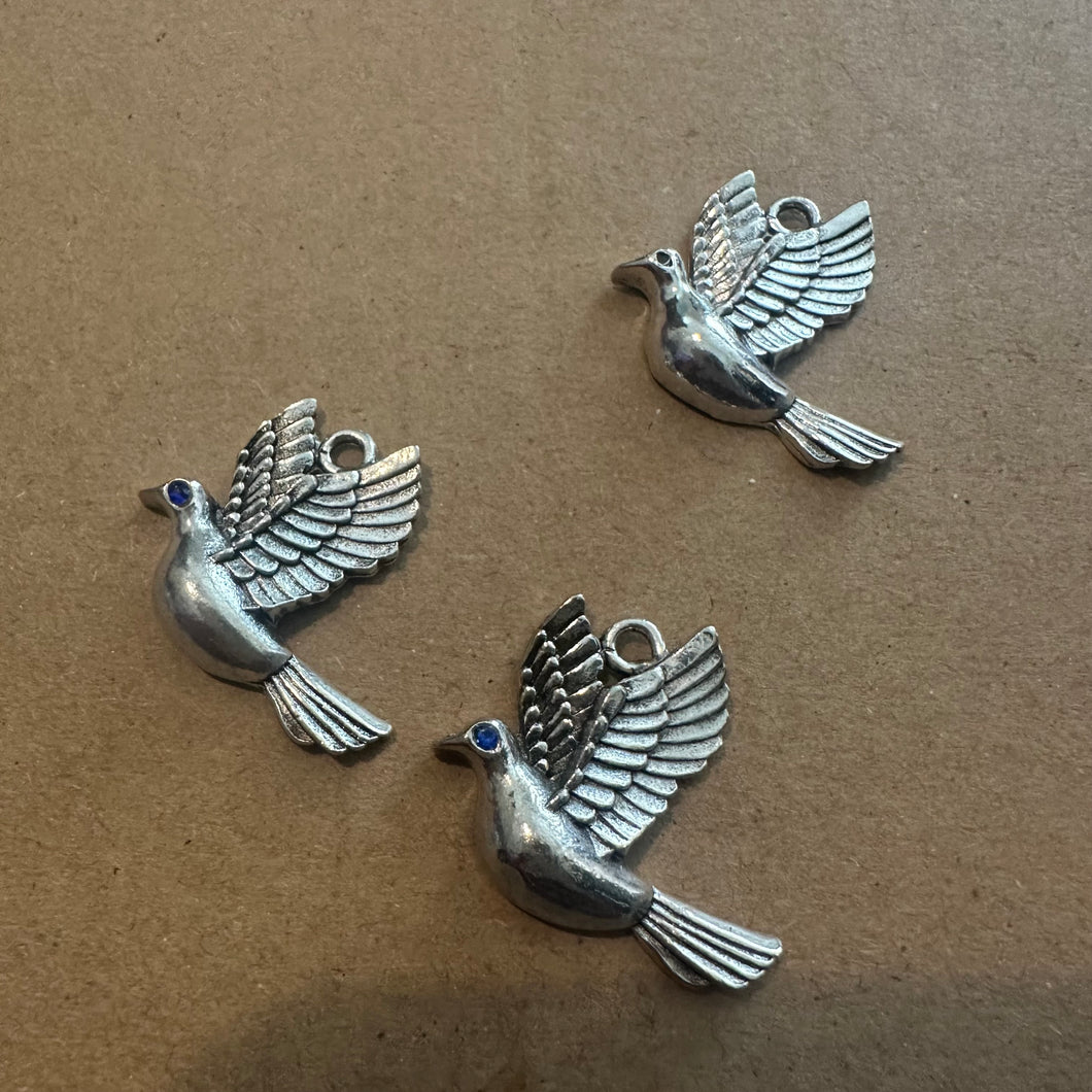 3 dove charms.