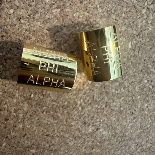 Bigger Alpha Phi Alpha charms.