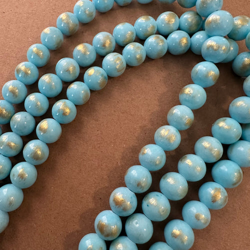 Light blue and gold beads -