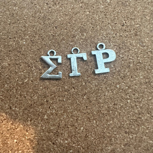 3 Sigma letter charms.