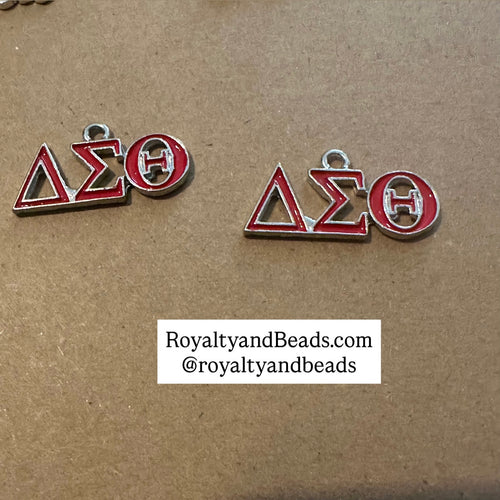 Red Delta dangle charm.