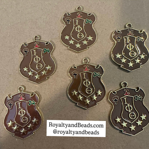 Gold Iota Phi Theta charm.