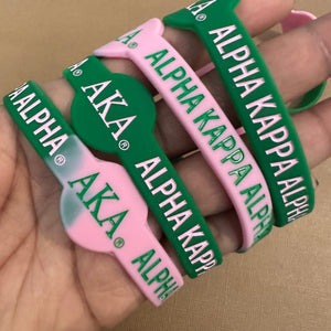 Pink and green Alpha Kappa Alpha wristband