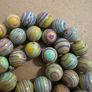 Yellow and purple swirl beads