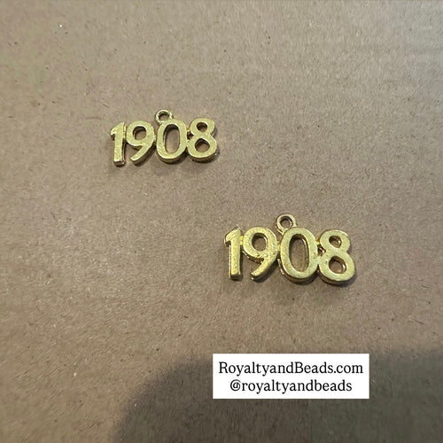 Gold 1908 charm