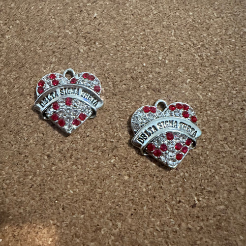 2 Delta heart charms.