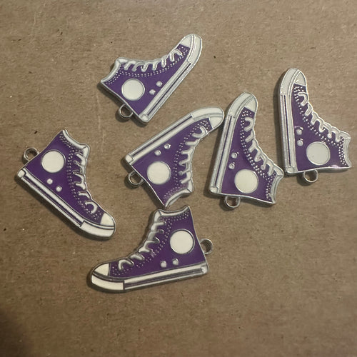 Purple tennis shoe charms.