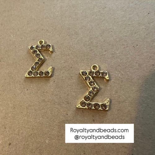 Gold Sigma charm.